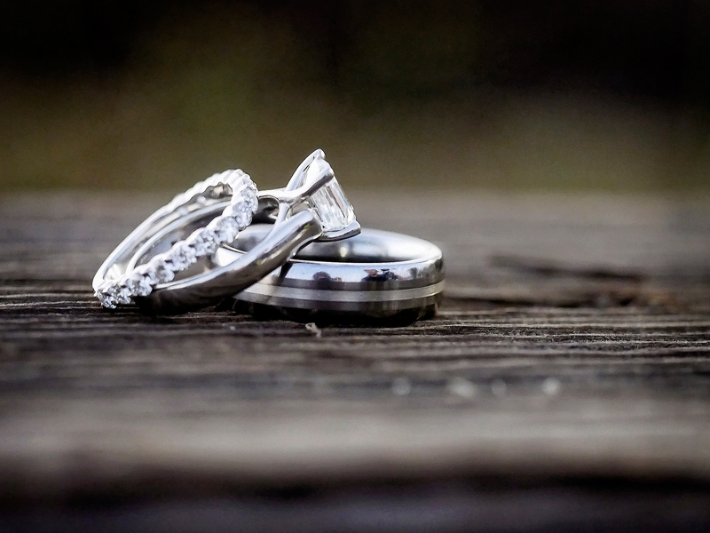 Closeup photo of bride and groom wedding rings - Rustic Wedding blog
